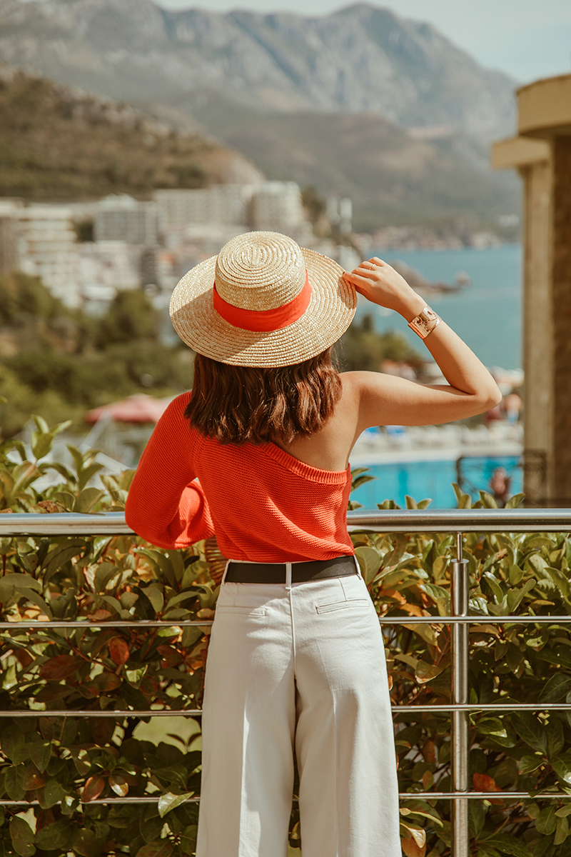 larisa costea, larisa style,larisa in montenegru,muntenegru,montenegro, summer holiday, belvedere residence, belvedere residence becici, becici, kotor,kotor bay,perast,budva, sveti stefan,nakd fashion, summer outfit, transitional outfit, summer-fall, new season, nakd, discount code, 20off, larisac_20, sales, straw hat, asos, summer sweater,one shoulder sweater,orange sweater, tangerine, larsia travels, travel the world, euro trip, road trip, micro sunglasses, asos green sunnies, whote asos jeans, zara jeans, cult gaia bag, mini ark nag, shopbop, bamboo bag, soludos slippers, slides, gucci belt, best view, belvedere, terrace, balcony view, pool, best vacation, est destinations, best hotels, luxyry apartments, fun, friends, summer, sun, best weather, happy