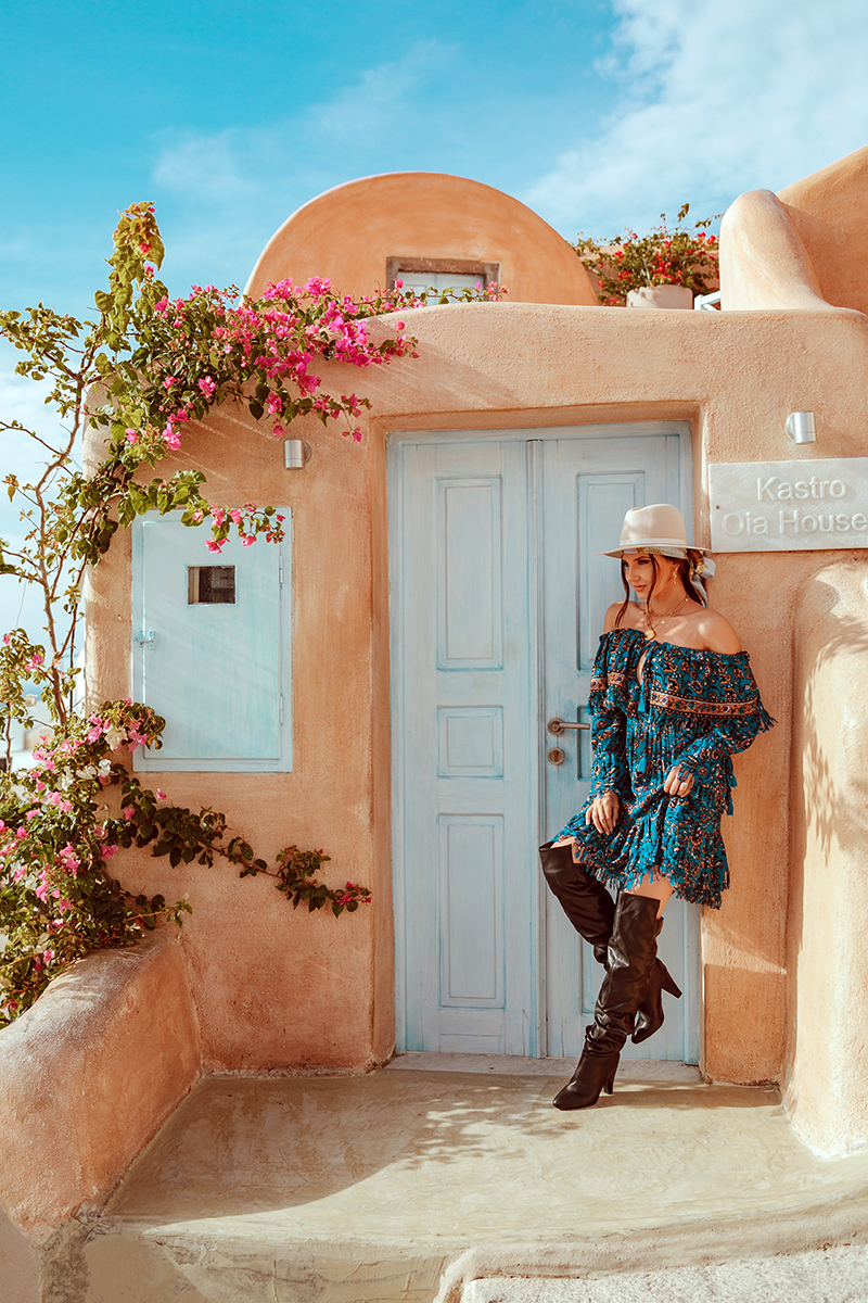 larisa costea,larisa costea blog,larisa costea style, larisa style, larisain greece,larisain santorini,santorini, greece,kiklades, oia, best view in oia, oia windmills,oia yellow building,oia orange house, castle view, ruin castlein oia, satorini, fashion blogger in satorini,travelblogger in satorini, travel blogger, fashion blogger, style blogger, what to wear in greece, greek island, best greek island, best destination, best vacation, besta look,bestalook, besta, missguided,missguided dress, blue boho gress, boho, gypsy, gyspsy style, boho chic,over the knee boots, black boots,knee high boots, fedora hat, club monaco hat, shopbop, chanel vintage coin, chanel ewelry, handmade by anca pop, gold necklaces, boho life, sunset in oia, caldera, caldera viewionic sea, october 2018, vacation, trip, adventure, best holiday trip, power couple, adrian sunrise inc, adrian mindroc, male blogger, men style, oia church, greek church, church bell,all white