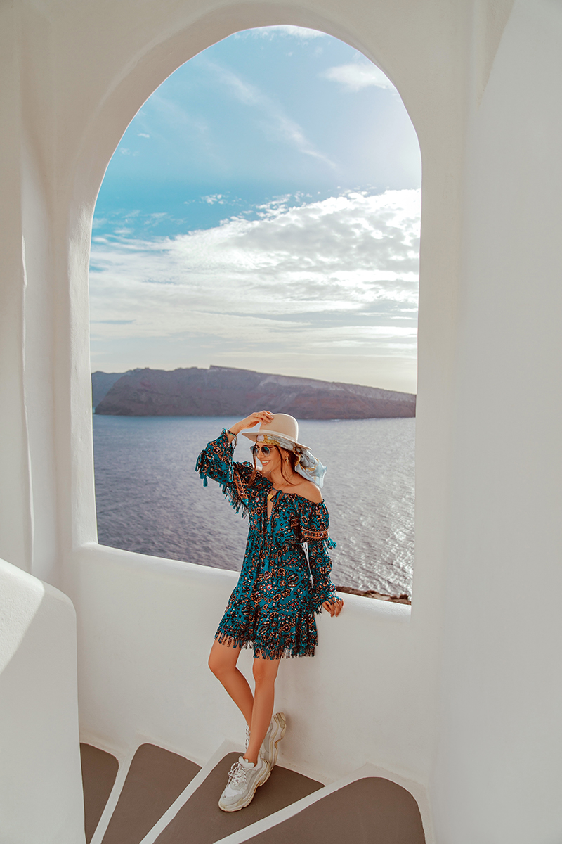 larisa costea,larisa costea blog,larisa costea style, larisa style, larisain greece,larisain santorini,santorini, greece,kiklades, oia, best view in oia, oia windmills,oia yellow building,oia orange house, castle view, ruin castlein oia, satorini, fashion blogger in satorini,travelblogger in satorini, travel blogger, fashion blogger, style blogger, what to wear in greece, greek island, best greek island, best destination, best vacation, besta look,bestalook, besta, missguided,missguided dress, blue boho gress, boho, gypsy, gyspsy style, boho chic,over the knee boots, black boots,knee high boots, fedora hat, club monaco hat, shopbop, chanel vintage coin, chanel ewelry, handmade by anca pop, gold necklaces, boho life, sunset in oia, caldera, caldera viewionic sea, october 2018, vacation, trip, adventure, best holiday trip, power couple, adrian sunrise inc, adrian mindroc, male blogger, men style, oia church, greek church, church bell,all white