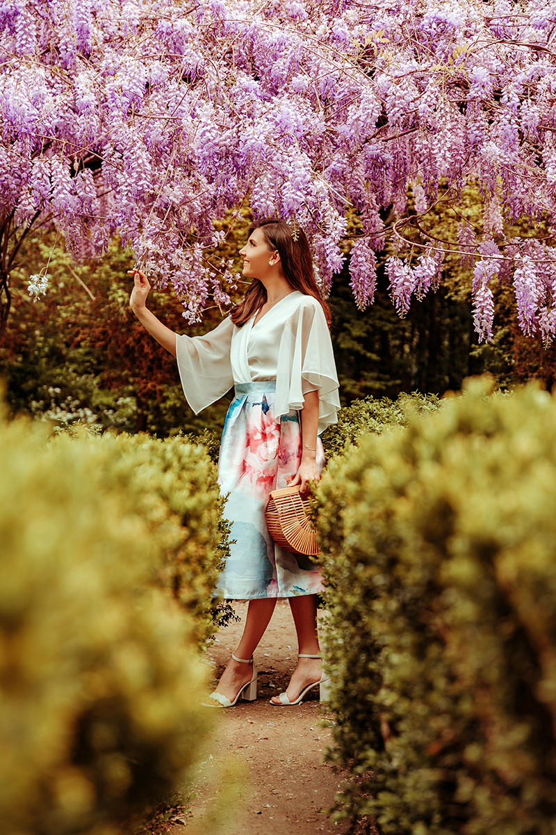 larisa costea, larisa costea blog, fashion blog, fashionista, chicwish, chicwish skirt, floral print skirt, a line skirt, watercolor skirt, florals, wisteria, wisteria hysteria, botanical garden, gradina botanica bucuresti, wisteria glicina, glicina, flowers, flower arch, bush, greenery, garden, enchanted garden, chicwish cape sleeves shirt, white shirt, white top, feminine look, ootd, outfit inspiration, what to wear, elegant look,baby blue, pink, cult baia bamboo bag, mini ark, sam edeleman sandals, white sandals, heel sandals, summer outfit, spring outfit, shopbop