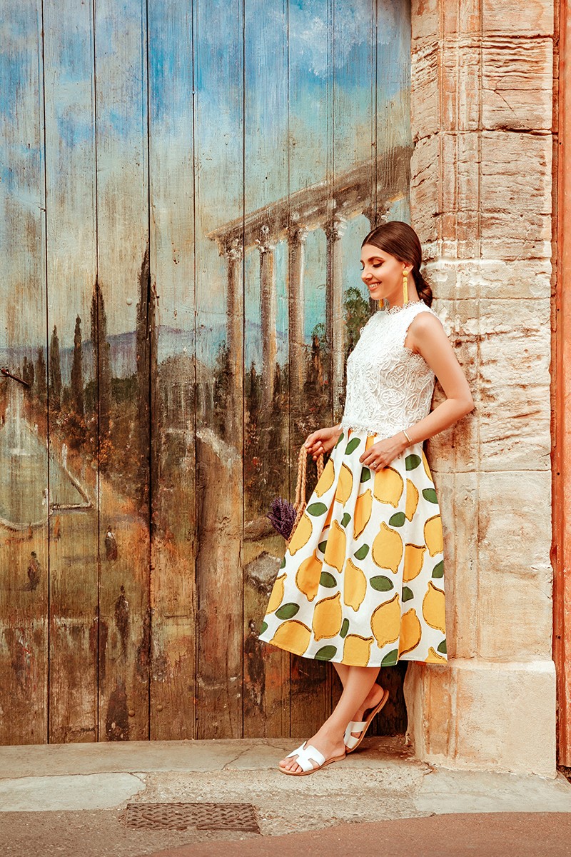 larisa costea, larisa costea blog, larisain provence,larisa style, fashion blog,travel blog, traveler, best destination, best vacation,summer 2019, rousillon,provemce, colorado provencal, canyons, red buildings,pink buildings, salmon buildings, chicwish ootd,chicwish full outfit, chicwish lace top,white lace top, a line skirt, chicwish skirt,lemon print skirt, white skirt, fruit print, lavender bouquest, straw bag, madewell, shopbop, white slides, perfect summer slides, ootd, outfit inspiration,primark earrings,yelloe earrings, bead earrings